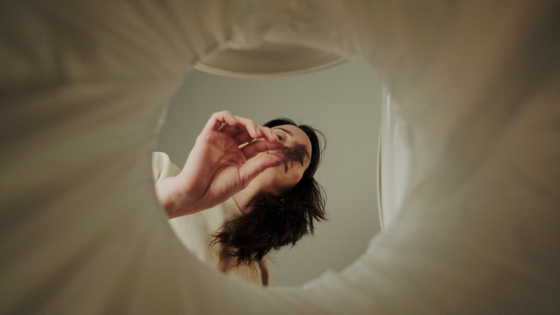 Still from the PPP advert — looking up through a toilet bowl